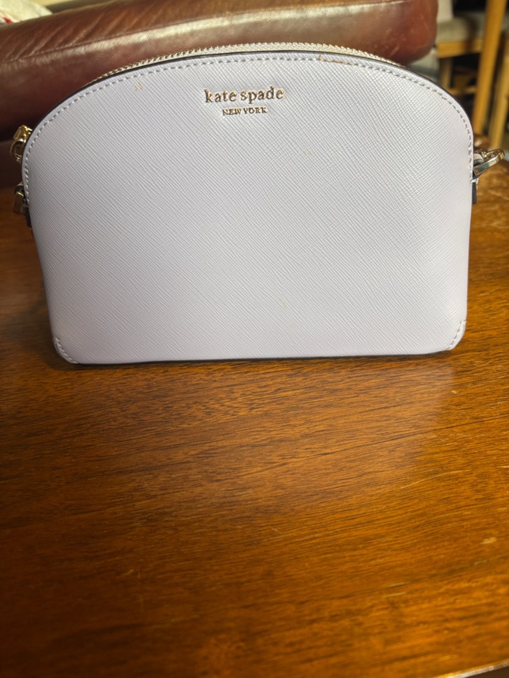kate spade small dome crossbody in pale lavender with gold hardware